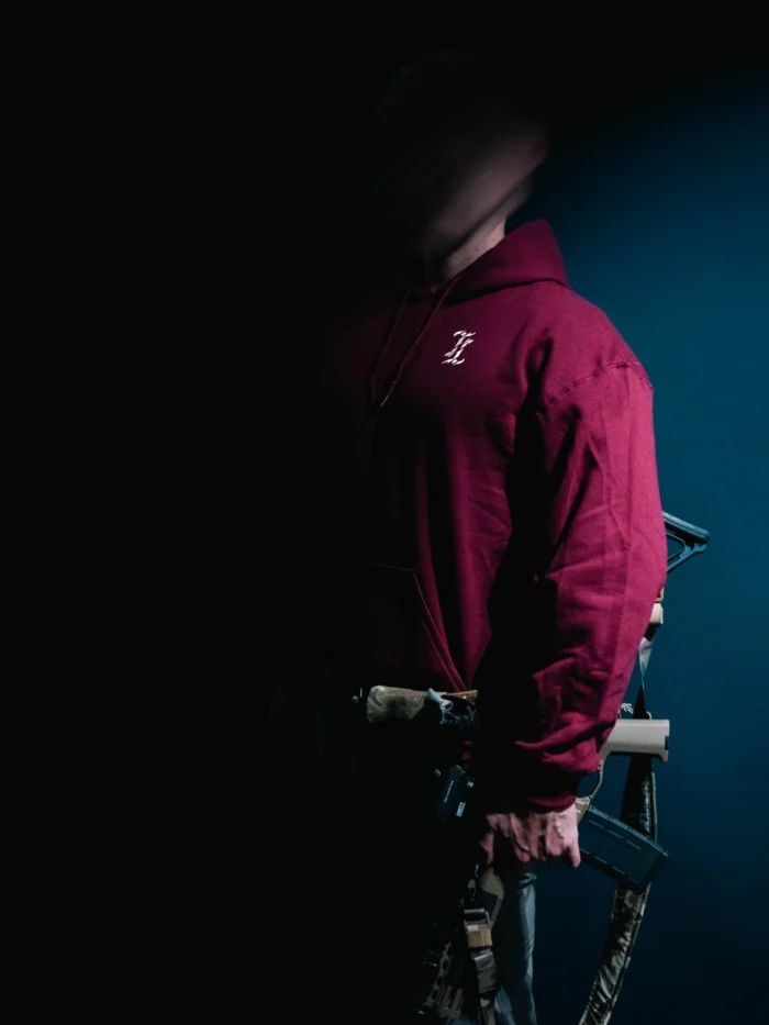 the trace mockup clothing featuring their T logo on the chest and a weapon on the hand