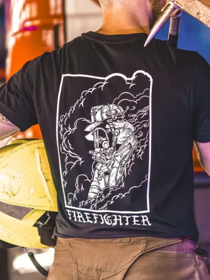 the trace shirt featuring a firefighter standing in front of a firetruck