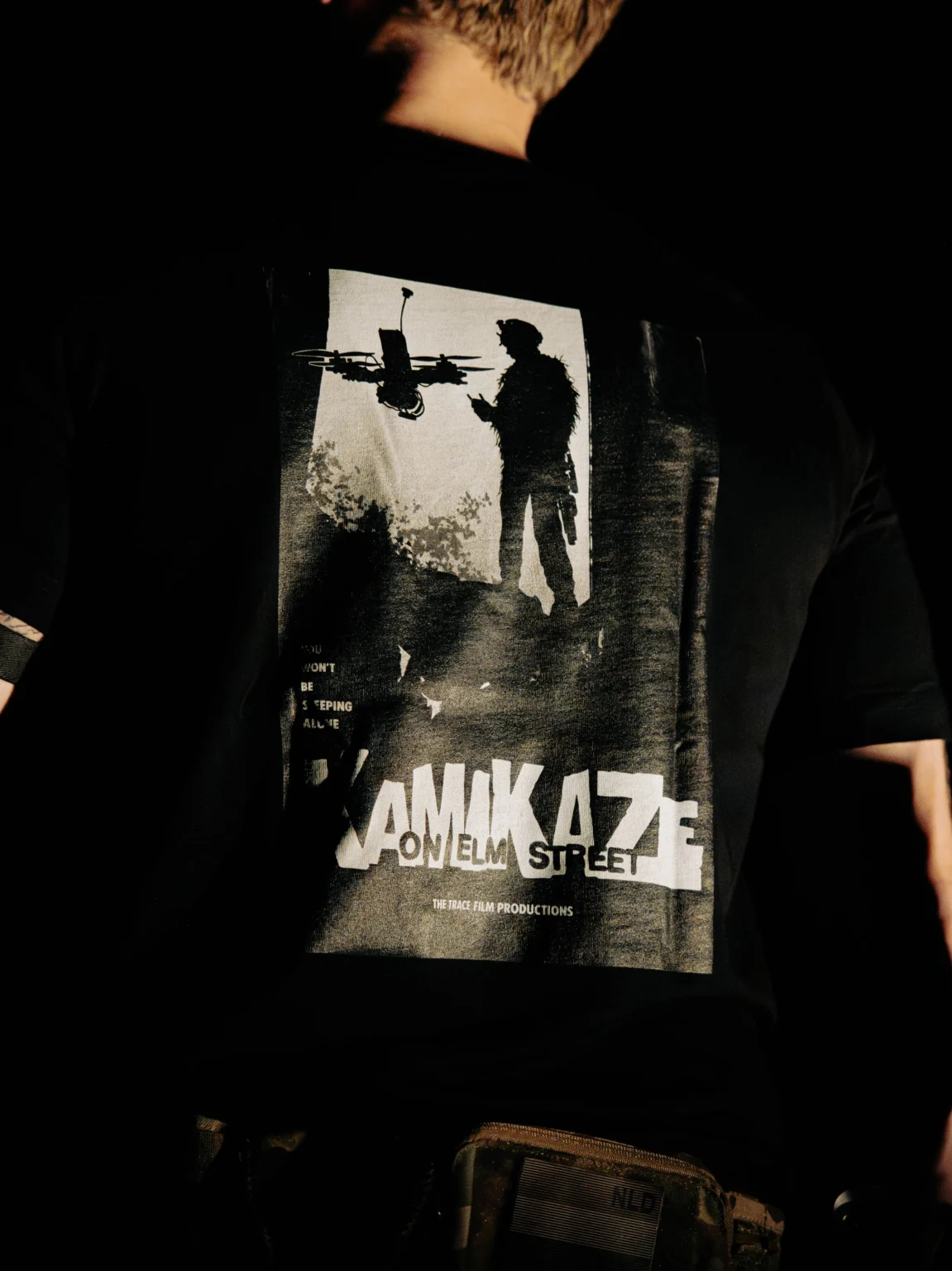 Close-up of the Kamikaze on Elm Street back print on the black The Trace T-shirt