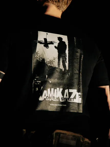 Close-up of the Kamikaze on Elm Street back print on the black The Trace T-shirt