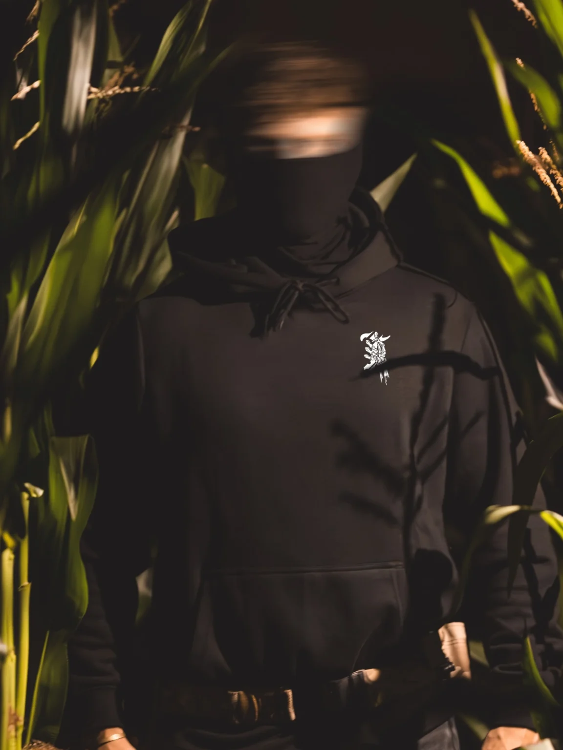 Halloween-T-skelet-hoodie-blur-4_3 Halloween Skeleton Logo hoodie in black by The Trace, chest print of a skeleton hand holding the T logo