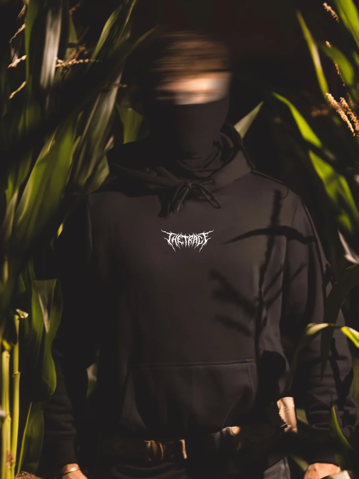 Halloween-TheTrace-hoodie-front-blur-4_3 the trace halloween hoodie with their logo on the chest