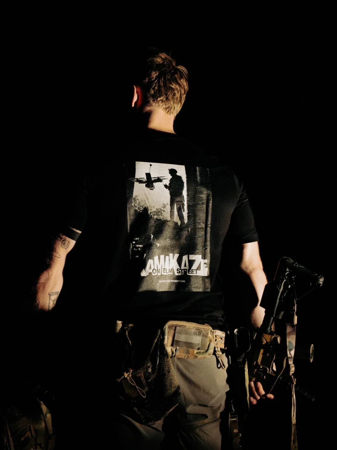 Kamikaze-shirt Halloween Kamikaze on Elm Street T-shirt in black by The Trace, back print with a soldier and an FPV drone poster