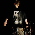 Halloween Kamikaze on Elm Street T-shirt in black by The Trace, back print with a soldier and an FPV drone poster