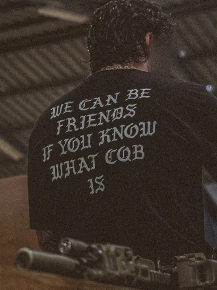 the trace oversized shirt with a text saying we can be friends if you know what cqb is