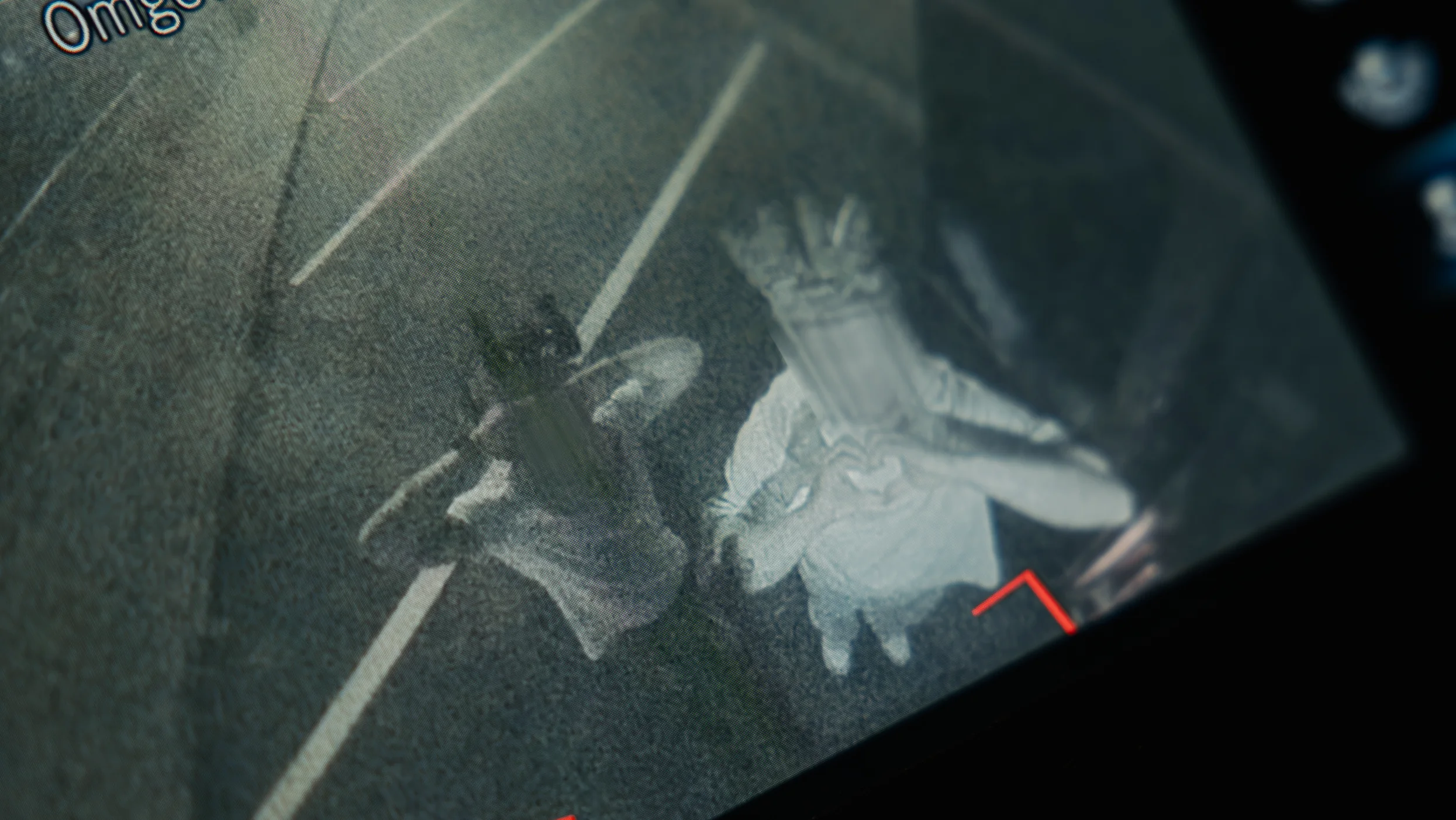 Two operators seen through a thermal screen while moving along a road at night